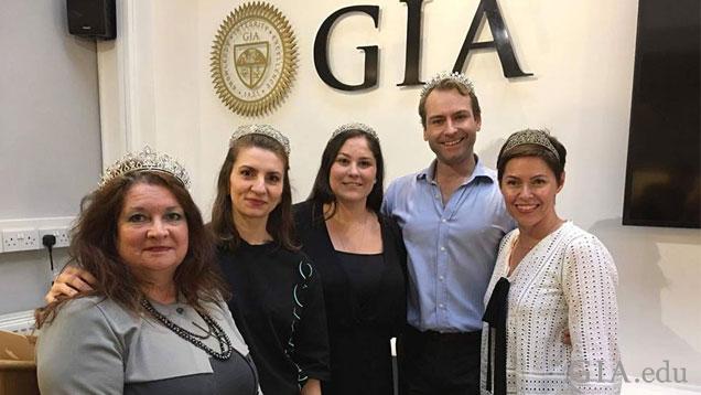Four woman wearing tiaras stand in a group with Andrew Prince. Four woman wearing tiaras stand in a group with Andrew Prince.