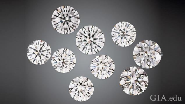 A group of nine round brilliant cut man-made diamonds on a black background. A group of nine round brilliant cut man-made diamonds on a black background.